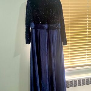 Navy blue gown with sequin top part. High low. Band around waist. Never worn.